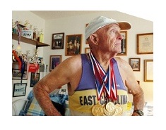 Charlie at home with medals around his neck